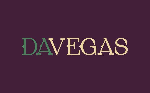 DaVegas Horizontal Logo. Green and beige letters against purple backdrop.